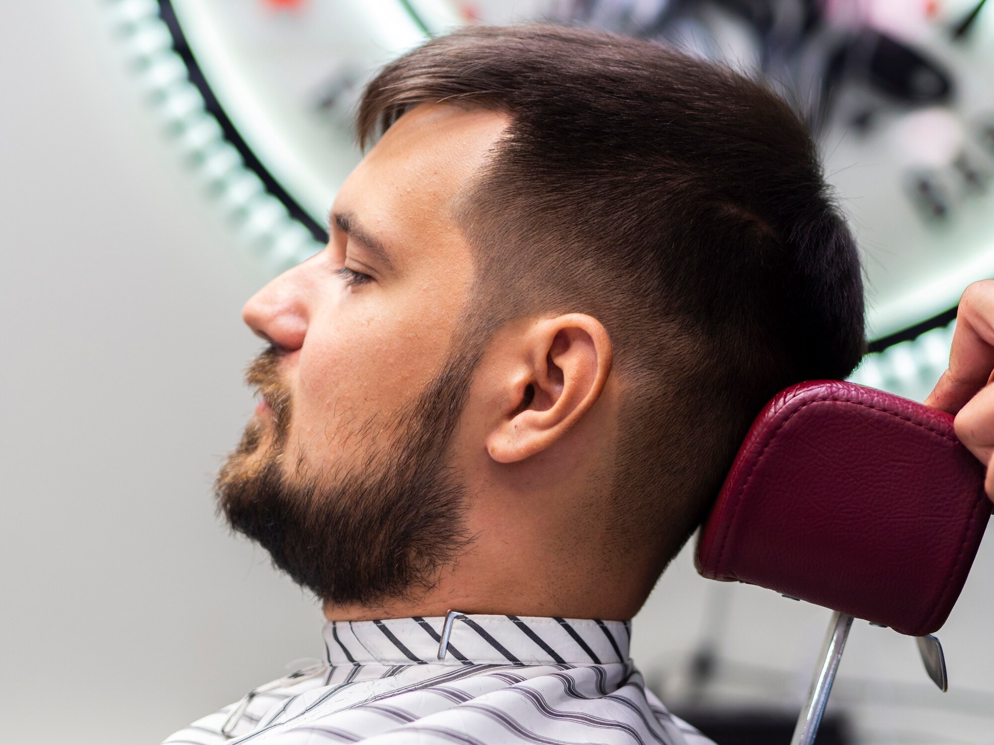 man sitting barber shop 23 2148256856